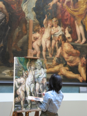 An artists refines her talent by copying a portion of a painting at the Louvre in Paris.
